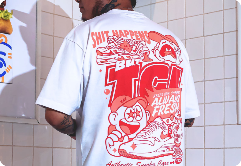 Apparel product — graphic T-shirt against white square tiles.