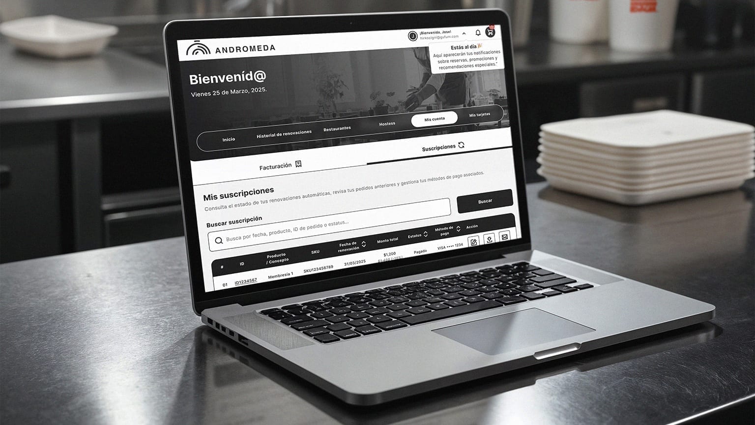 Andrómeda subscription and billing portal on a laptop.