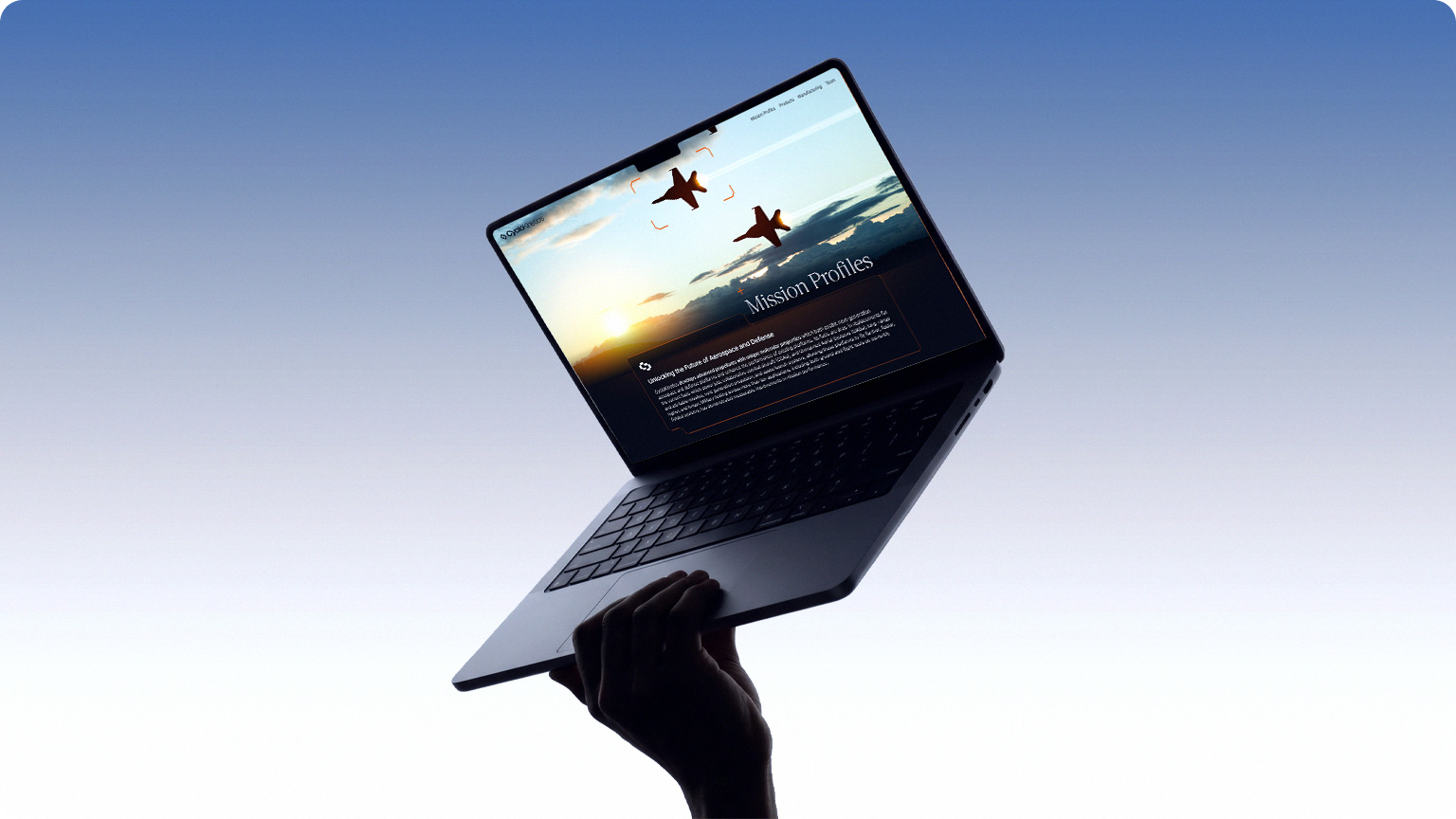 Mission Profiles page on a laptop held against the sky.