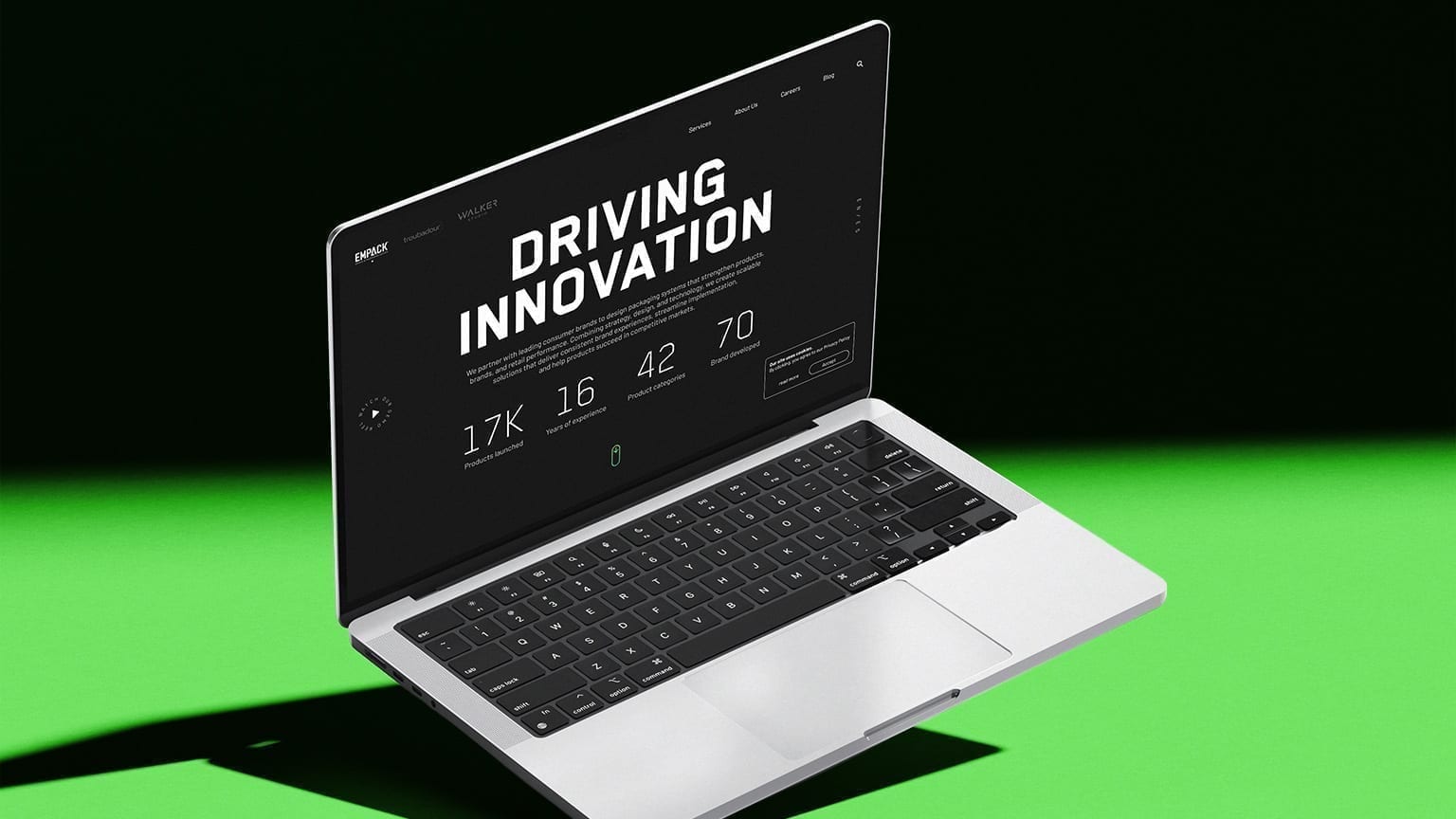 Empack desktop homepage on a laptop mockup with scale indicators.