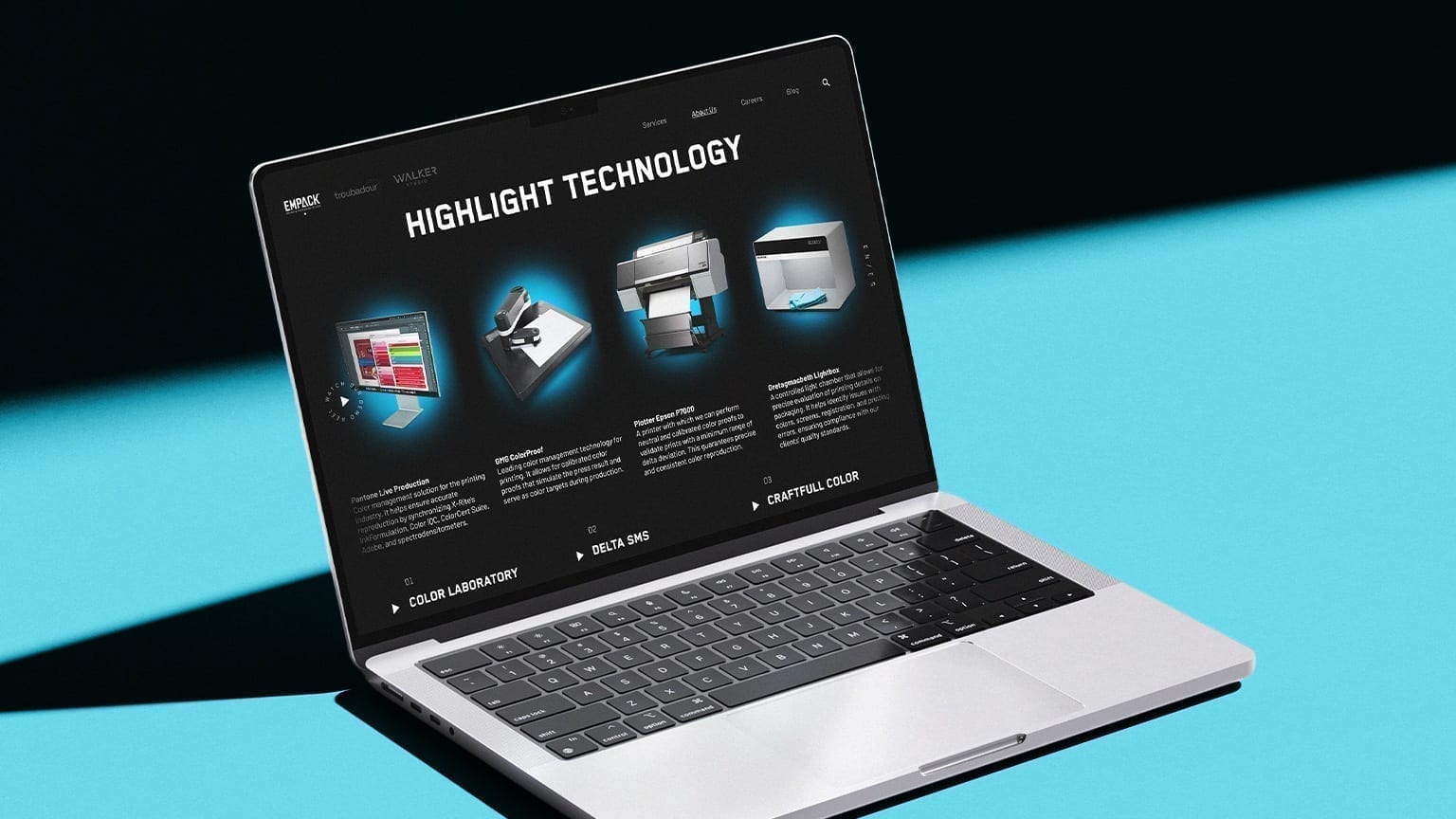 Empack production technology page with pre-press equipment on a laptop mockup.