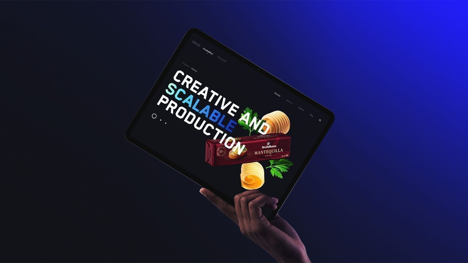 Troubadour services page on a tablet mockup with Noche Buena butter product.