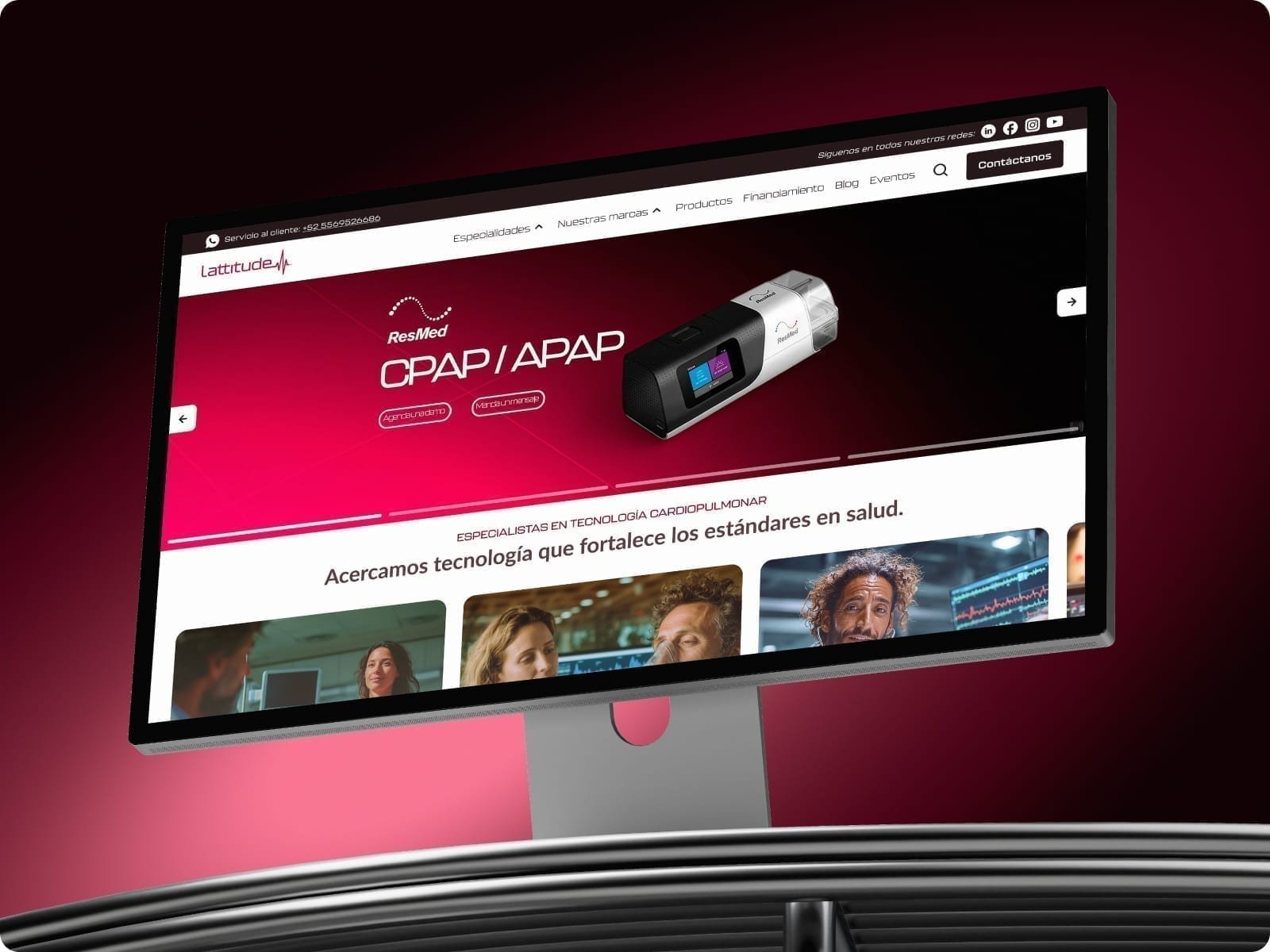 Desktop monitor on a dark surface showing the Lattitude cardiovascular technology homepage with a magenta hero.