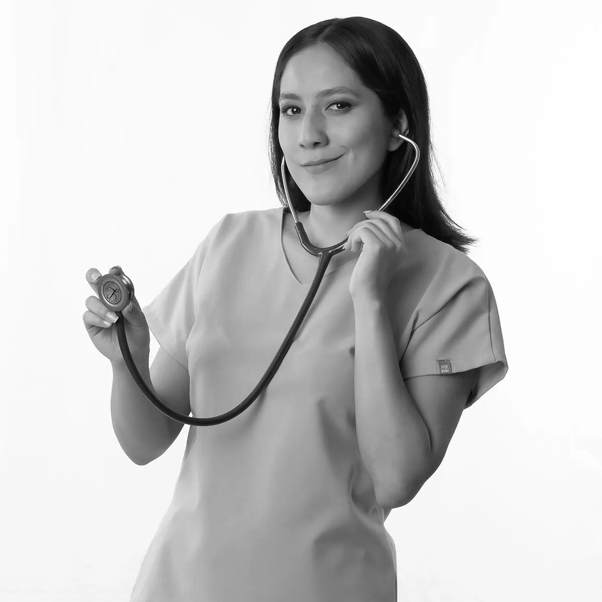 Black-and-white portrait of Cynthia holding a stethoscope.