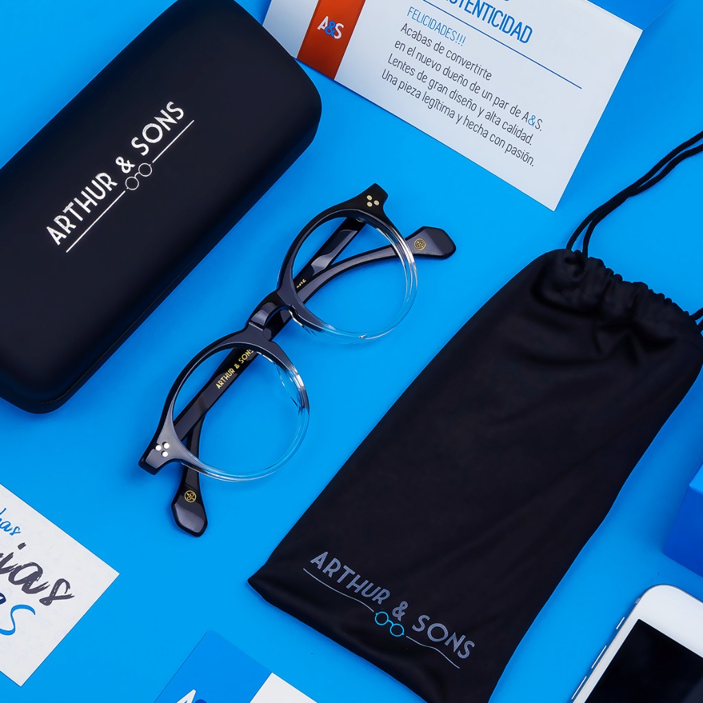Diagonal open cases with metallic A&S lid logo and black frames including Valerie temple print on electric blue. Arthur & Sons Mexico collection — photograph 119 of 119.