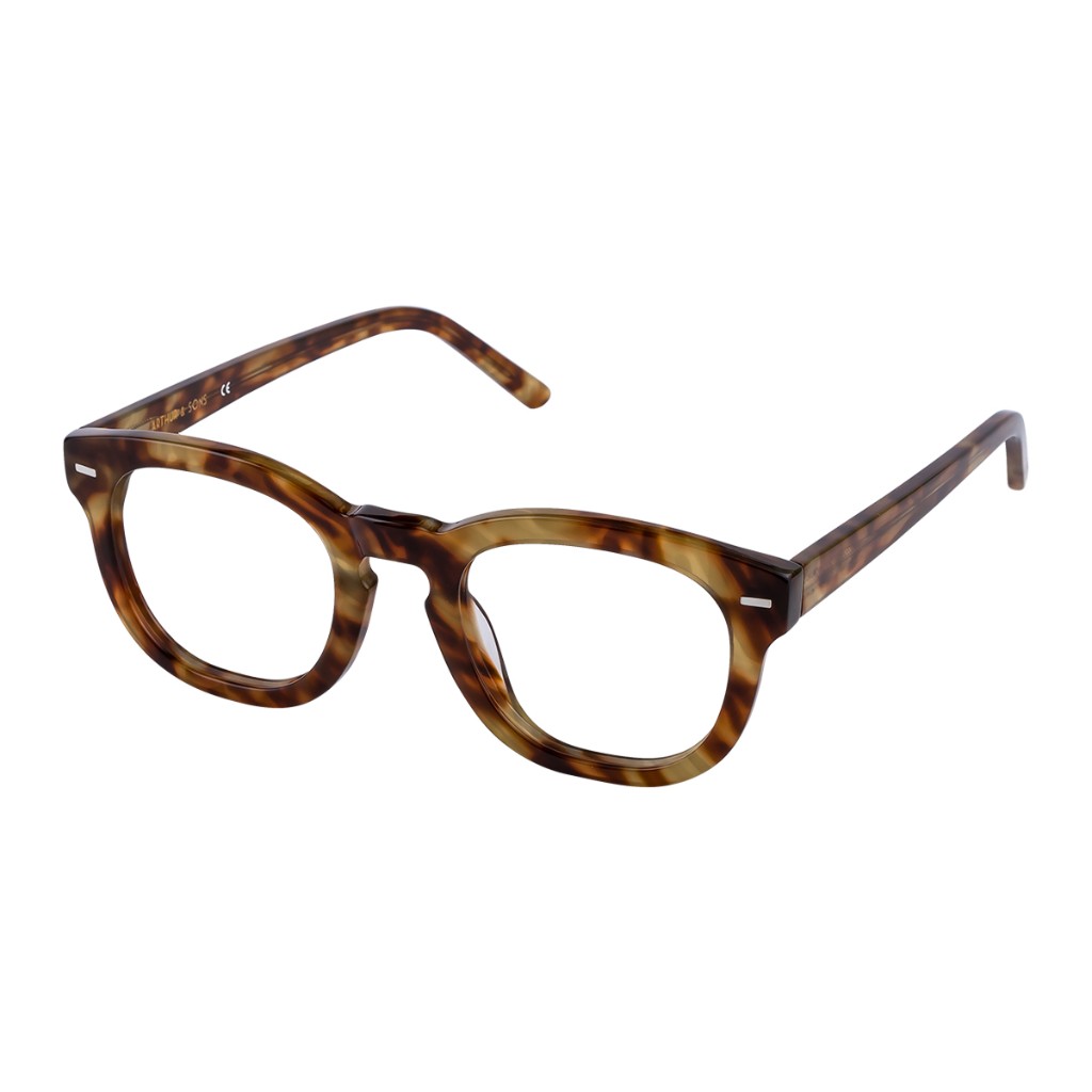 Side profile of tortoiseshell acetate frames with gold spectacles logo on temple tip; white seamless. Arthur & Sons Mexico collection — photograph 73 of 119.