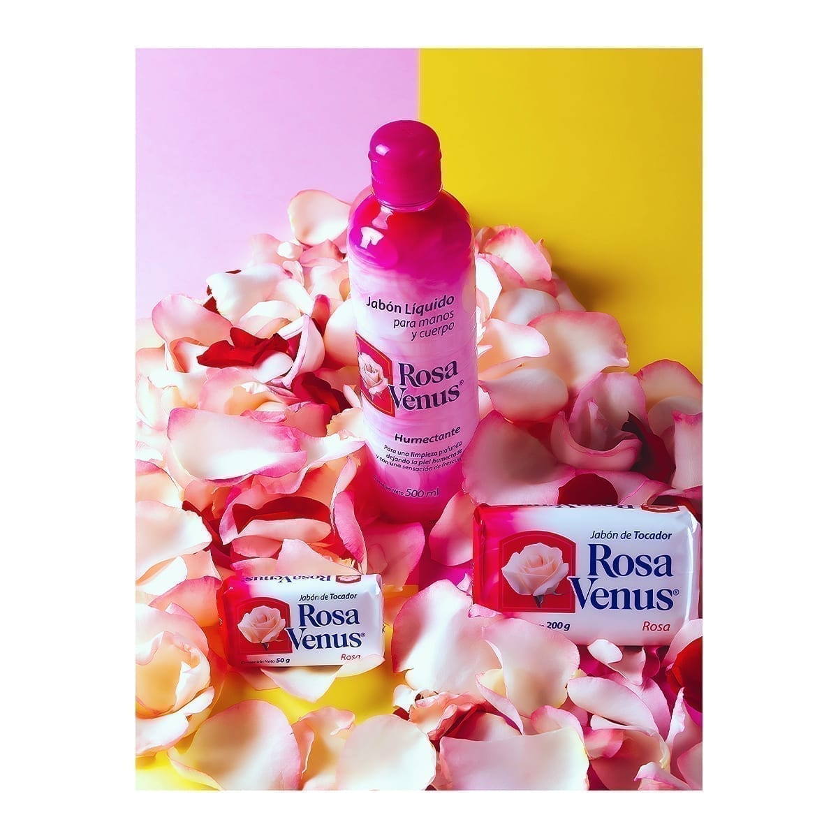 Rosa Venus lineup: 500 ml liquid with 50 g and 200 g toilet bars on petals; pink and yellow background. “100 Years of History” editorial project, Fábrica de Jabón La Corona — piece 23 of 38.