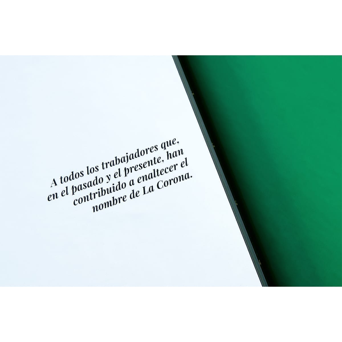 Dedication page to workers who have honored La Corona’s name; green facing page. “100 Years of History” editorial project, Fábrica de Jabón La Corona — piece 32 of 38.