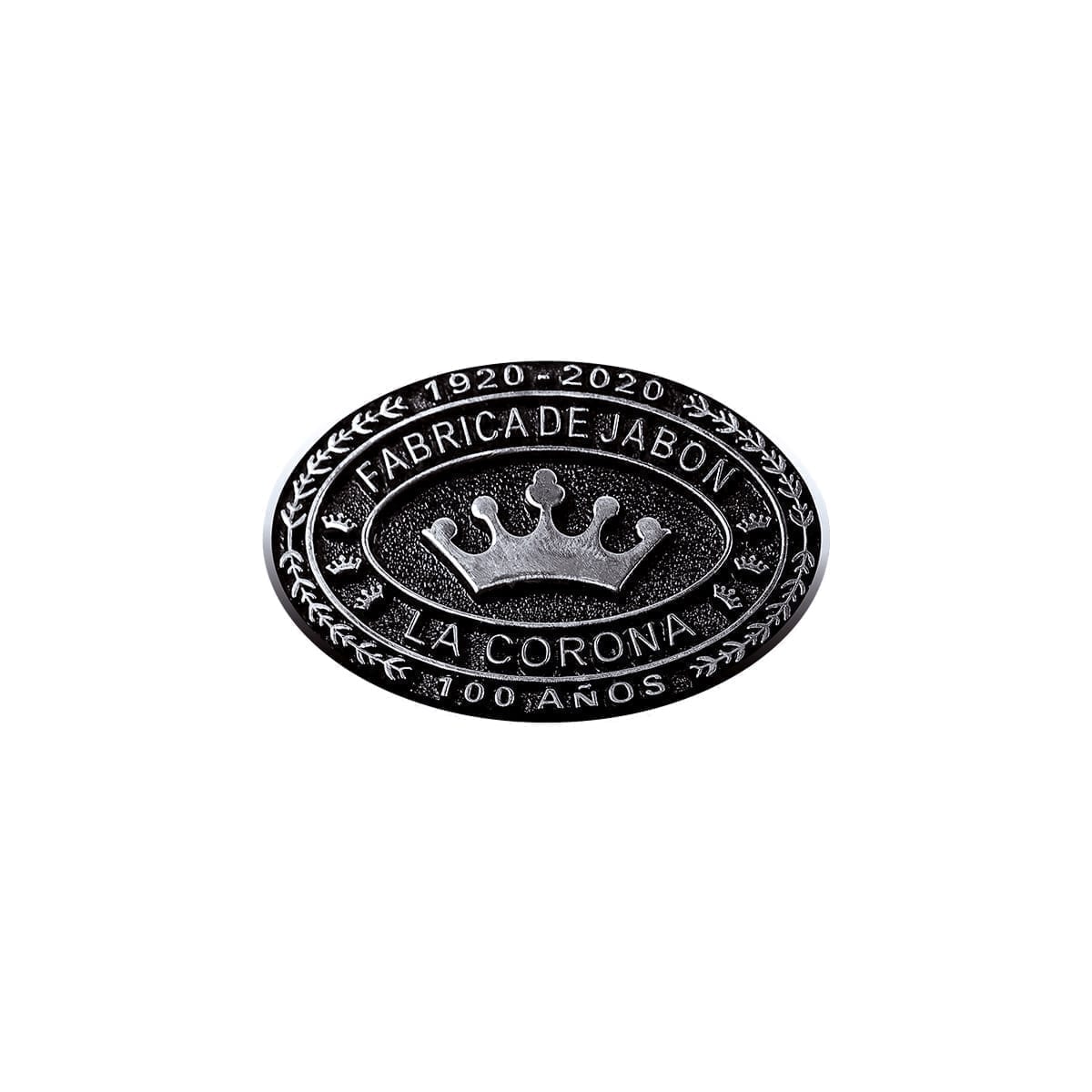Oval metallic centenary medallion “1920–2020,” “100 AÑOS,” crown and laurels; Fábrica de Jabón La Corona. “100 Years of History” editorial project, Fábrica de Jabón La Corona — piece 9 of 38.