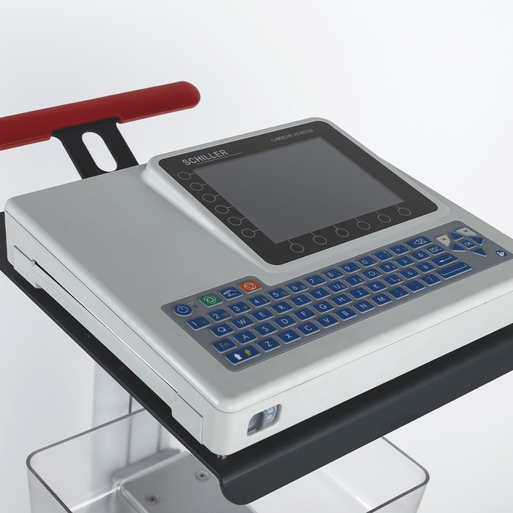 Cardiovit AT-102 G2 on a mobile cart: red handle, black shelf, clear bin below — Lattitude clinical mobility.